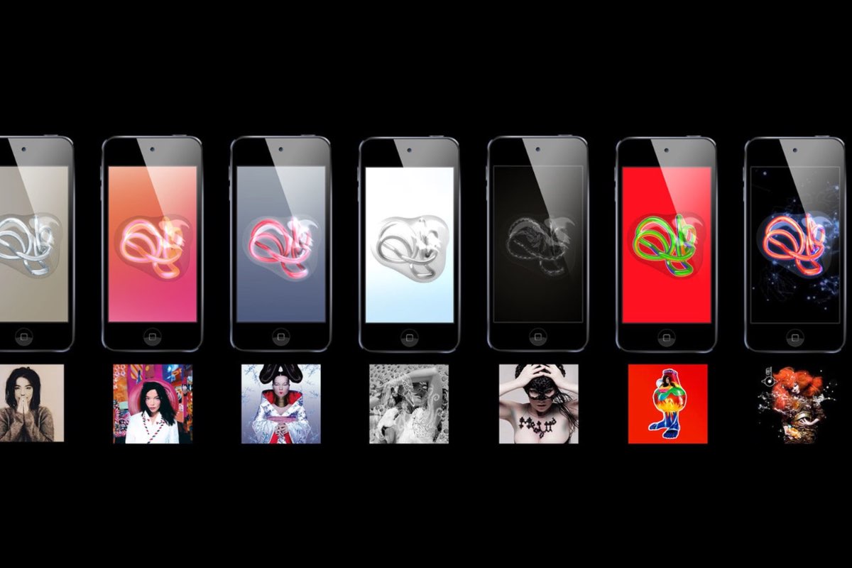 A row of iPod touch devices showing the Björk Digital album artworks.
