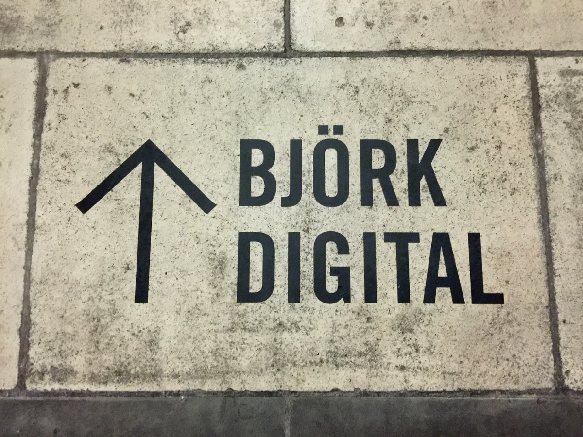 ‘Björk Digital’ floor vinyl with a directional arrow.