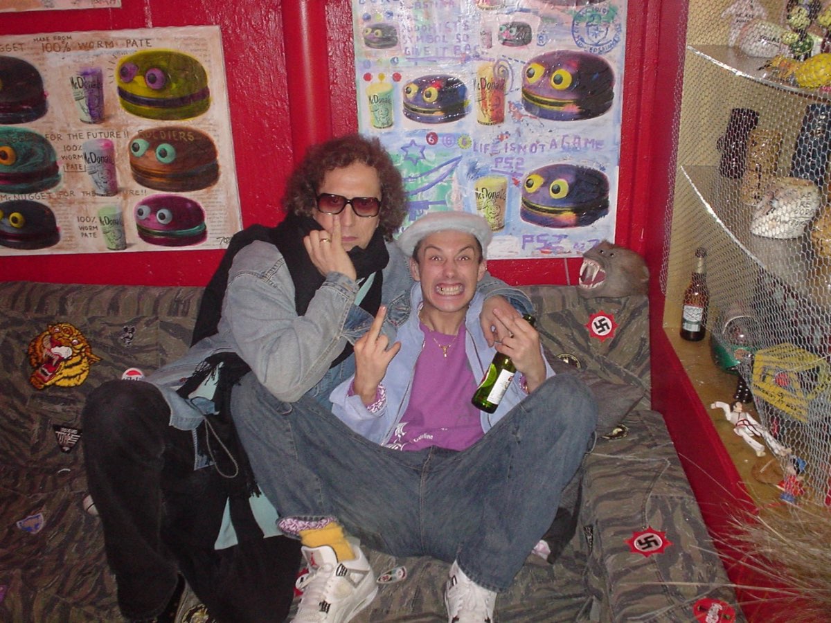 Andrew Melchior with Mick Rock on a graffiti-covered set.