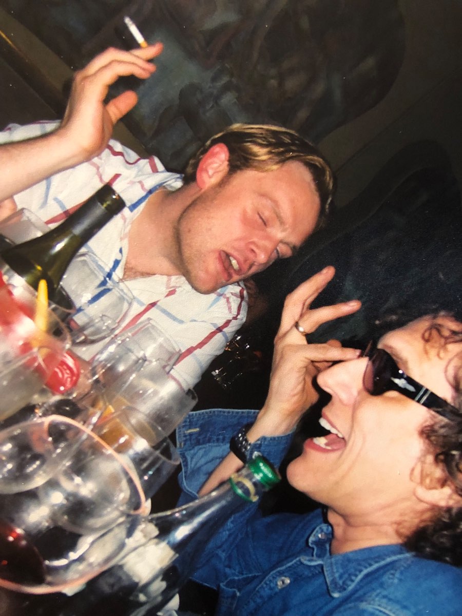 A late-night party scene with Mick Rock.